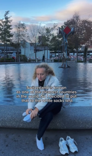 LJUDI JE OPTUŽILI DA LAŽE Devojka 15 minuta  šetala Bazelom u belim čarapama, pa pokazala koliko su se isprljale (VIDEO)